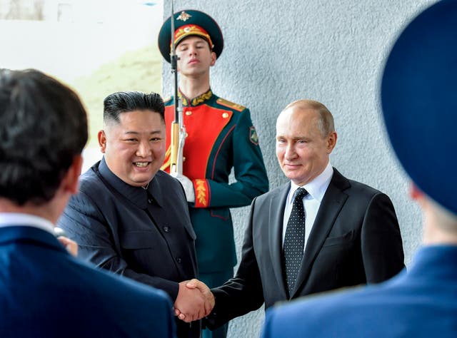 <p>North Korea’s leader Kim Jong-un and Russian president Vladimir Putin shake hands during a meeting in 2019 </p>