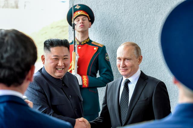 <p>North Korea’s leader Kim Jong-un and Russian president Vladimir Putin shake hands during a meeting in 2019 </p>