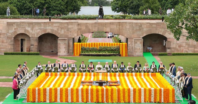 <p>India’s prime minister Narendra Modi, centre, paying homage with other world leaders at Mahatma Gandhi’s memorial in Raj Ghat</p>