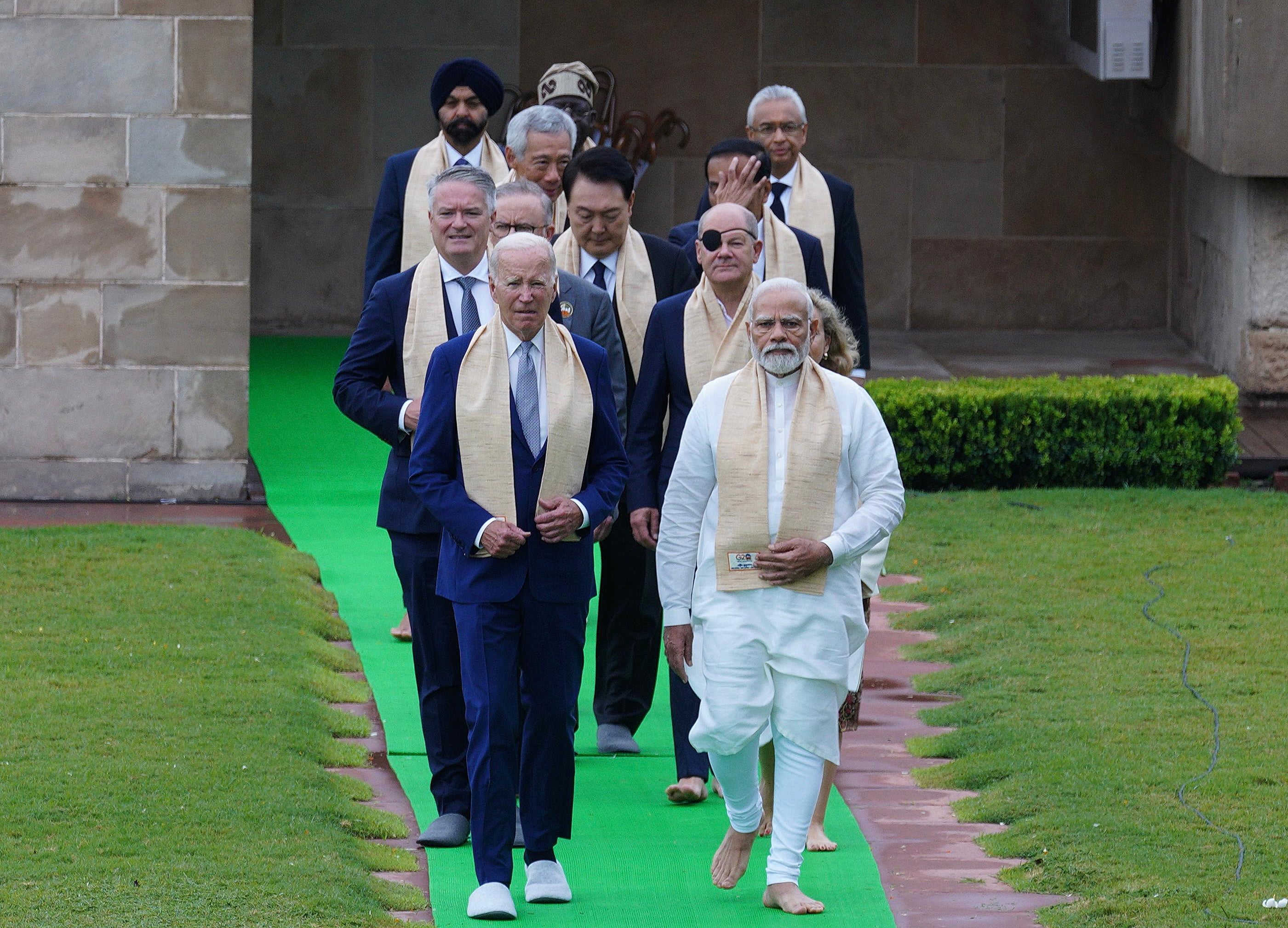 Indian prime minister Narendra Modi (front right) walks with US president Joe Biden and others at the Gandhi memorial yesterday