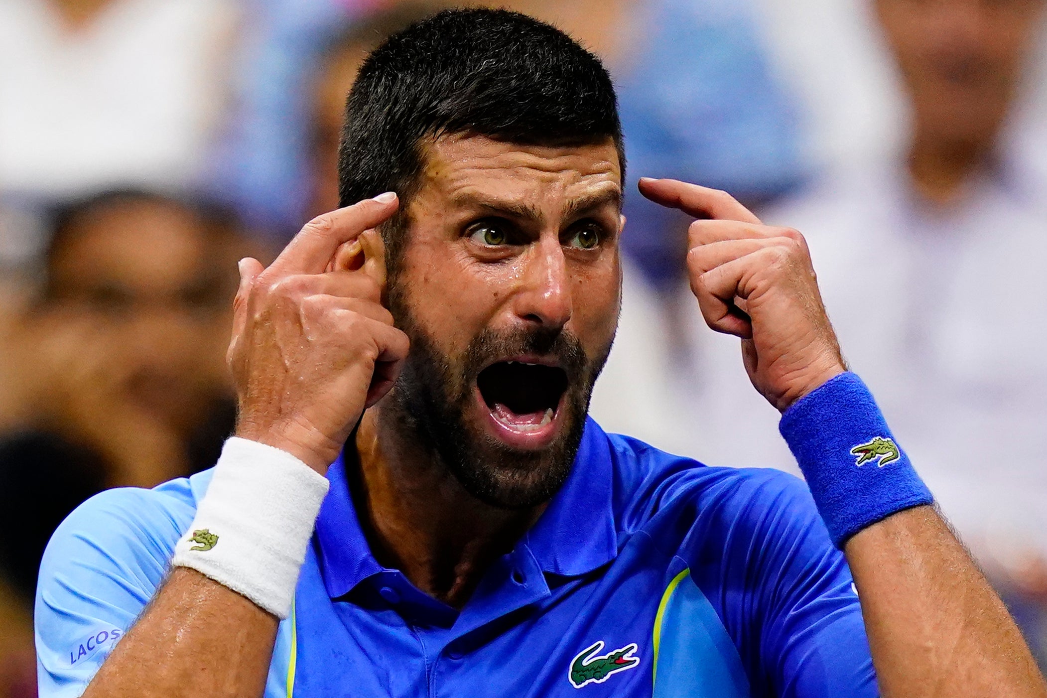 Novak Djokovic, of Serbia, reacts during a break in play against Daniil Medvedev