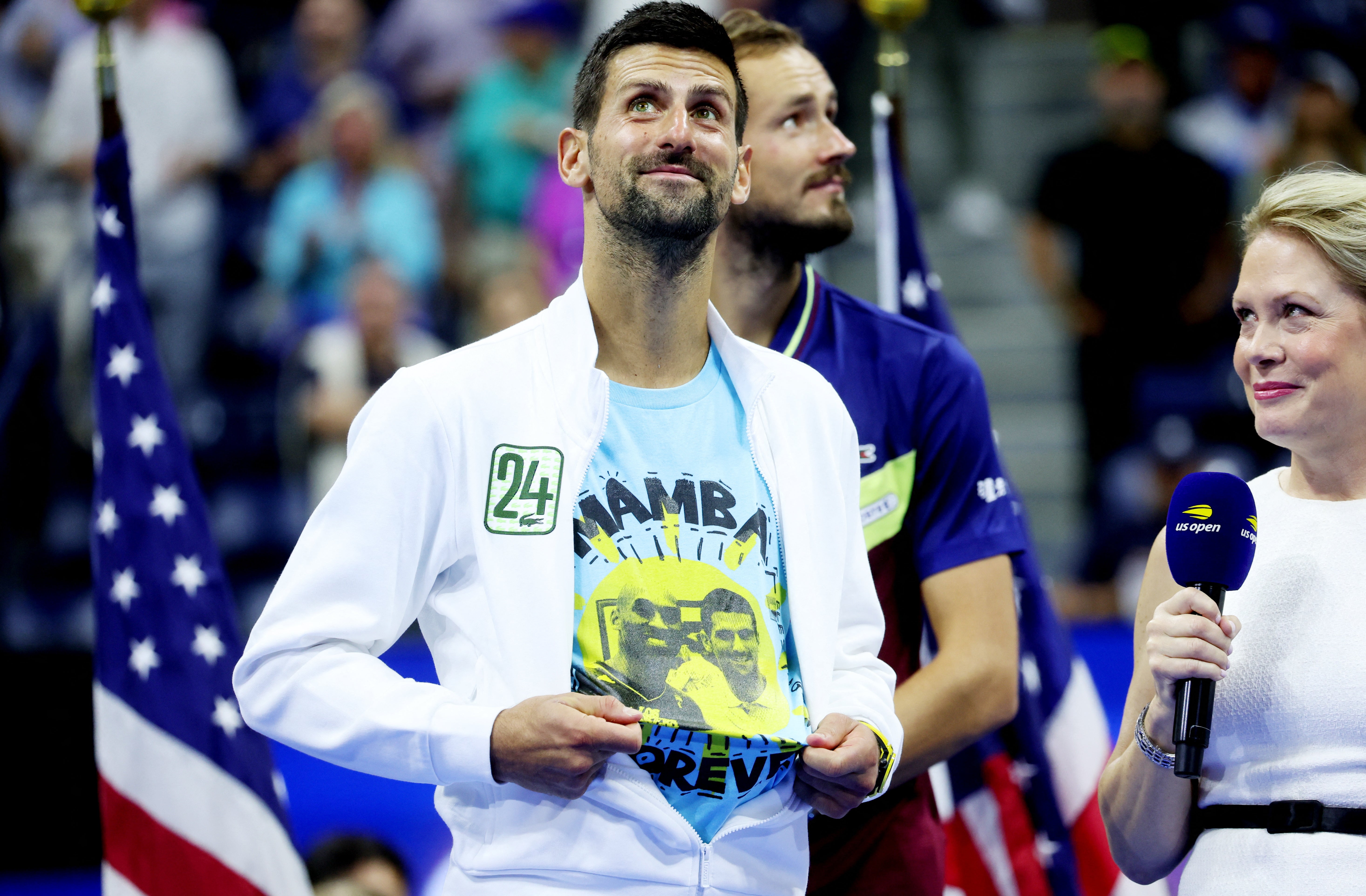 Novak Djokovic celebrates while wearing a shirt with an image of Kobe Bryant