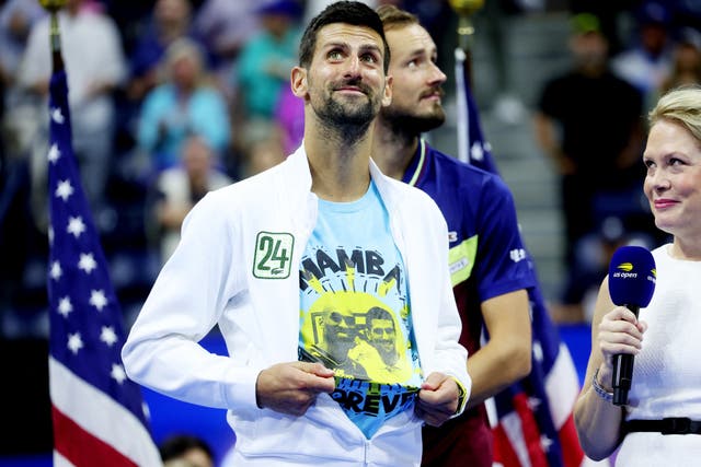 <p>Novak Djokovic celebrates while wearing a shirt with an image of Kobe Bryant</p>