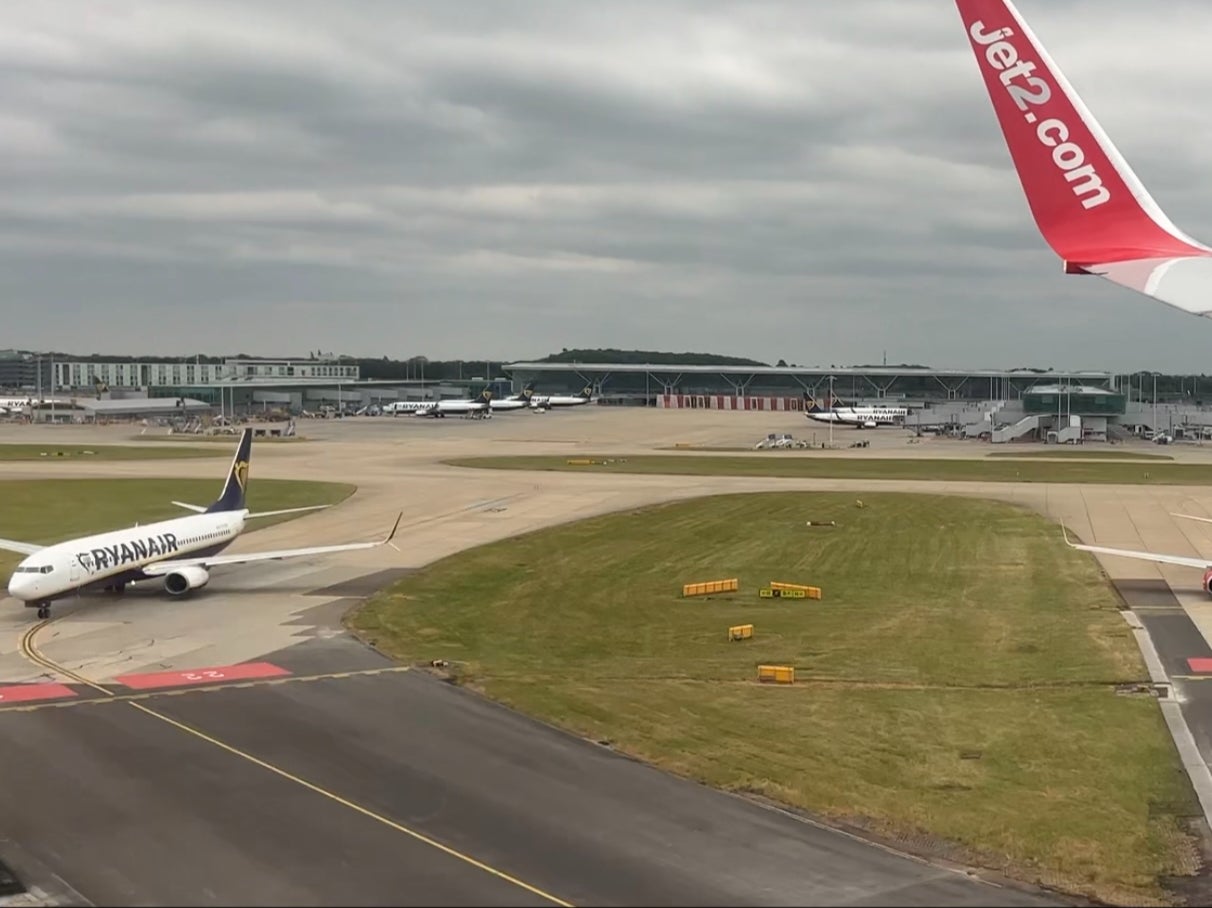 Quick turnaround: Jet2 Boeing 737 landing at London Stansted while a Ryanair aircraft waits to depart