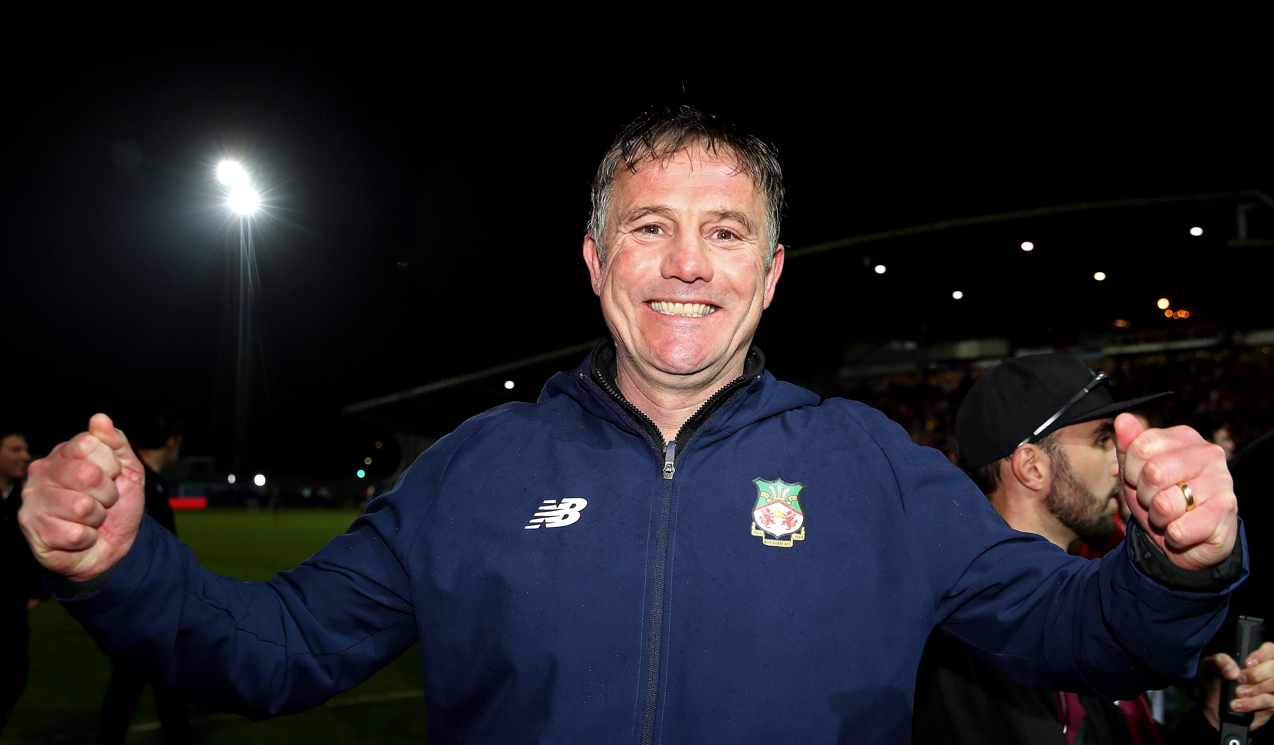Phil Parkinson, manager, celebrates after Wrexham are promoted to the English Football League