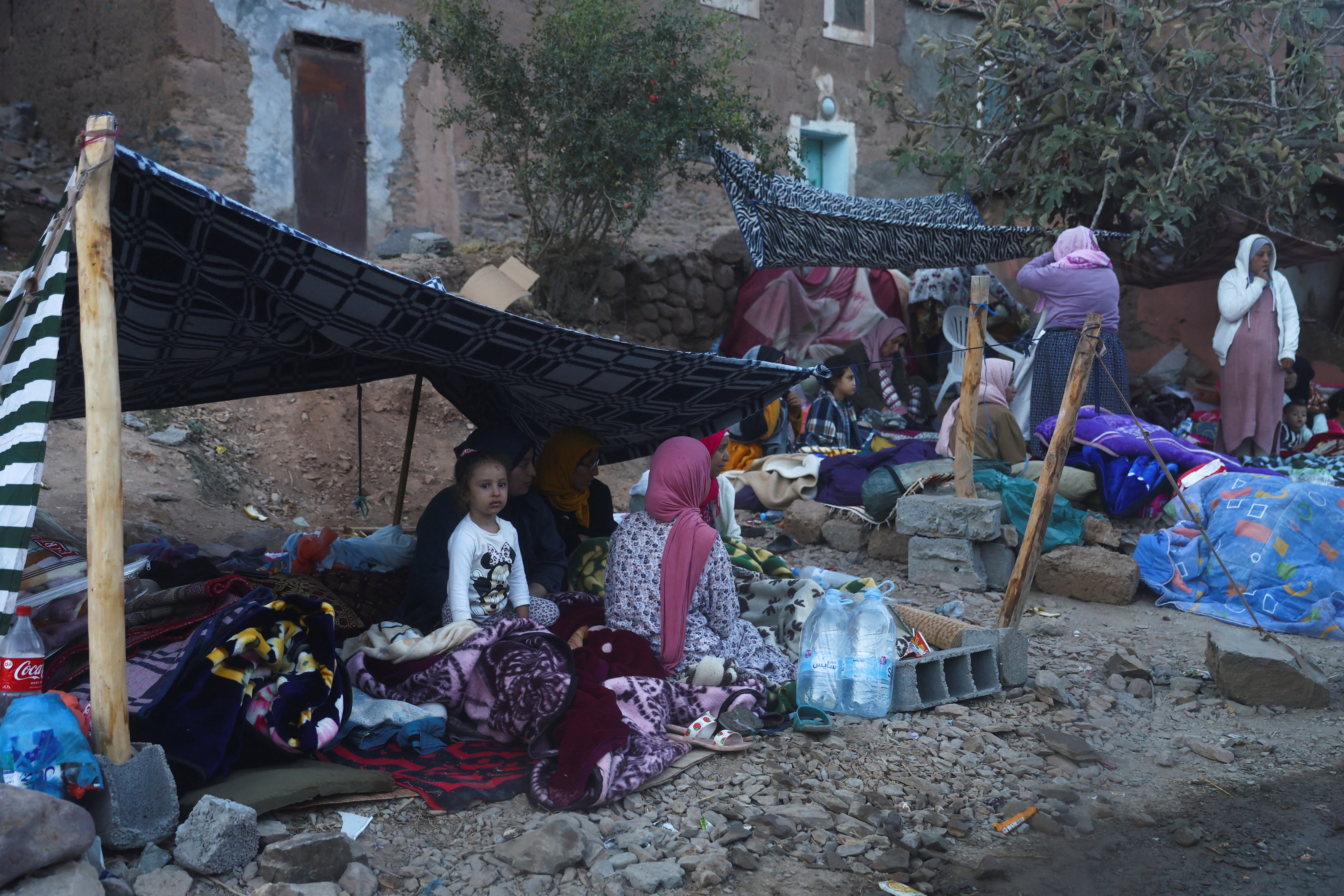 eople camp on the roadside in the aftermath of a deadly earthquake in Imgdal, Morocco