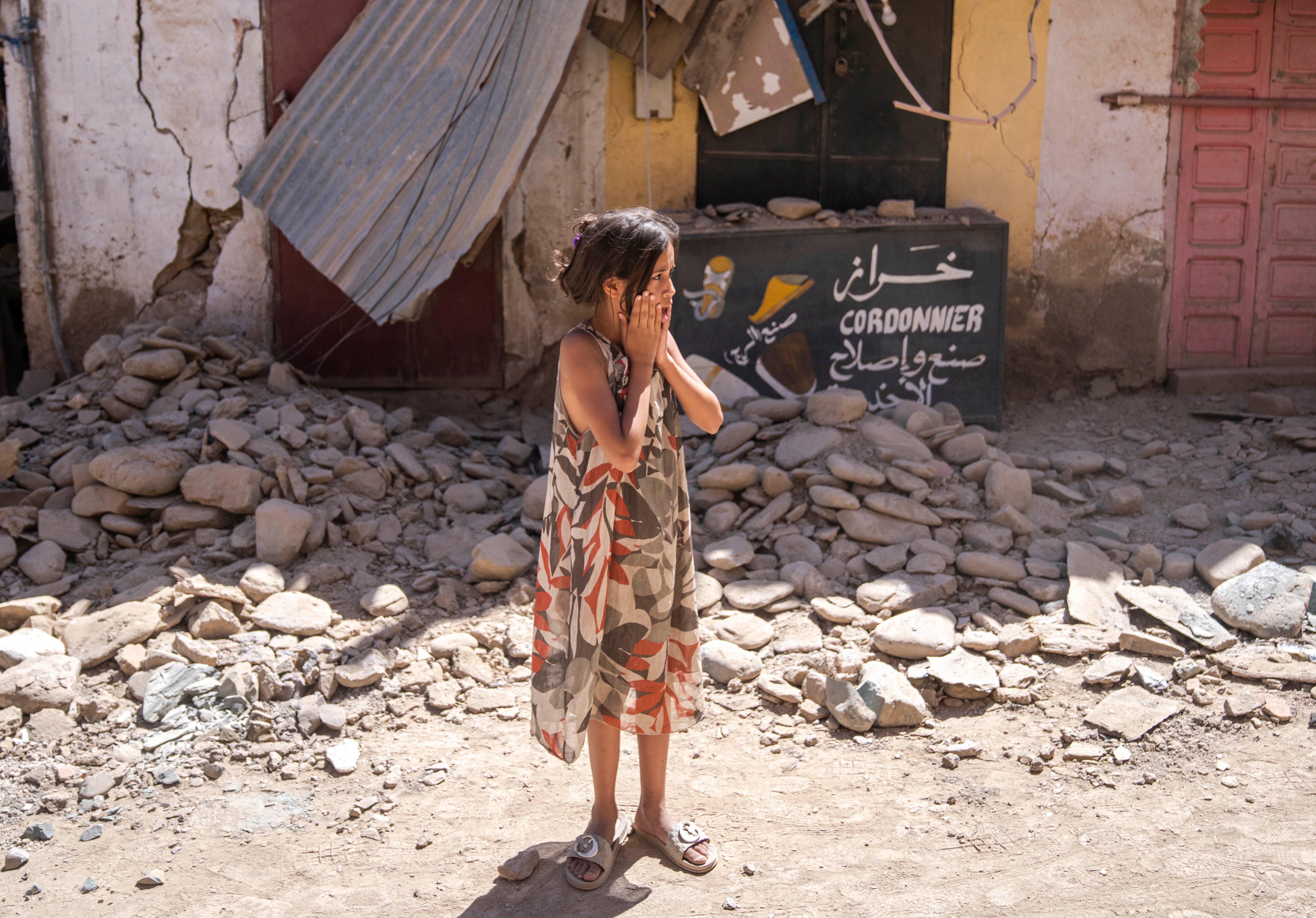 File photo: A child reacts after inspecting the damage caused by the earthquake, in her town of Amizmiz, near Marrakech