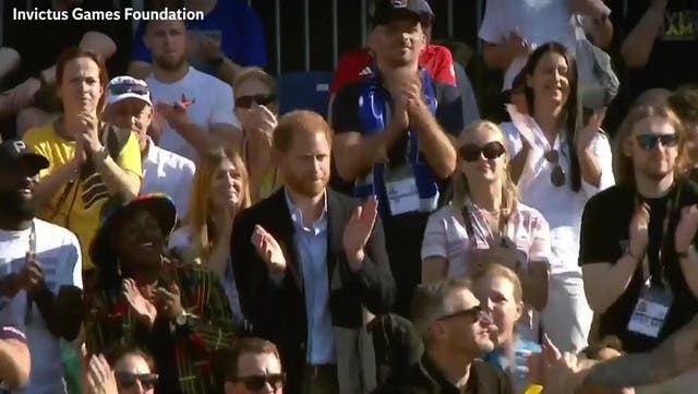 <p>Prince Harry cheers as he watches track and field finals at the Invictus Games.</p>