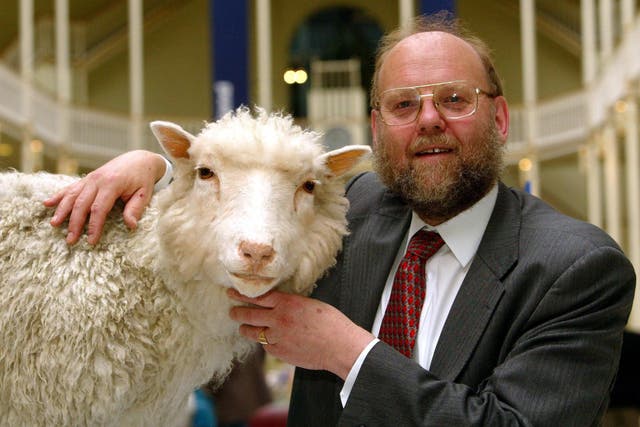 Professor Ian Wilmut with Dolly the sheep in the National Museums of Scotland (Maurice McDonald/PA)
