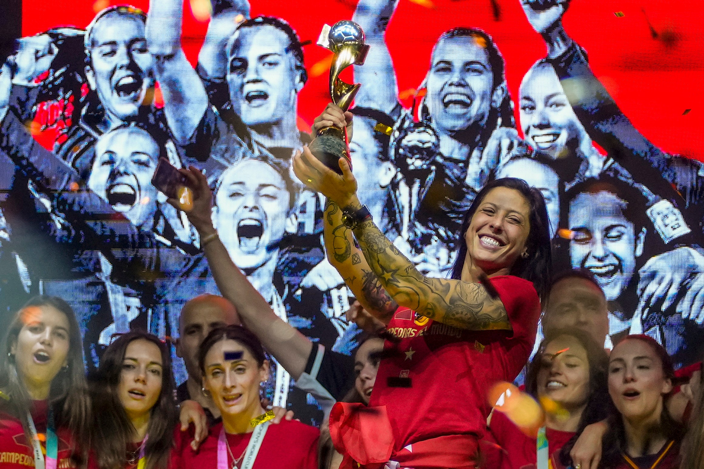 Hermoso holds the trophy as Spain celebrate their Women’s World Cup victory on stage in Madrid in 2023