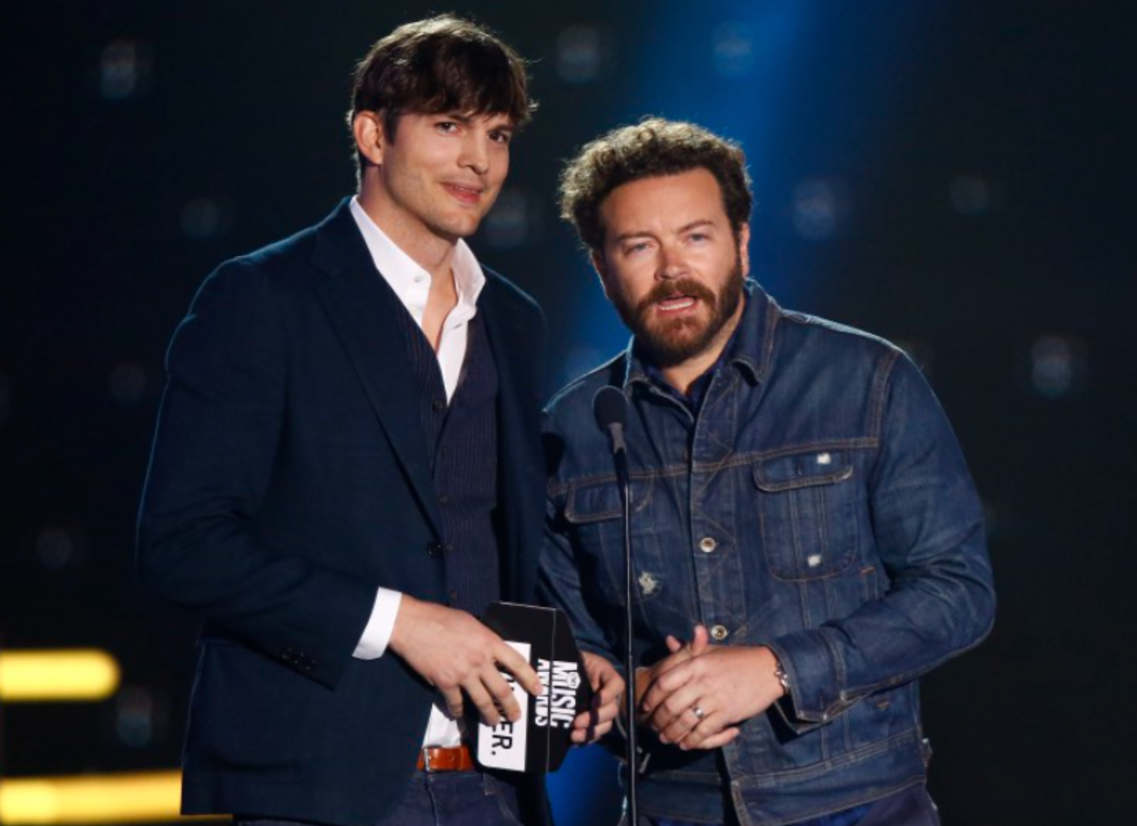 Ashton Kutcher, left, and Danny Masterson present the award for collaborative video of the year at the CMT Music Awards at Music City Center on June 7, 2017