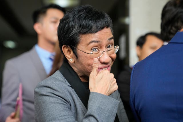 <p>Filipino journalist Maria Ressa, 2021 Nobel Peace Prize winner and Rappler CEO, gestures as she talks to reporters after being acquitted by the Pasig Regional Trial Court over a tax evasion case in Pasig city, Philippines on Tuesday, 12 September 2023</p>