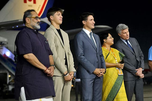 <p>Canada's Prime Minister Justin Trudeau (3L) arrives at the airport on the eve of two-day G20 summit in New Delhi</p>