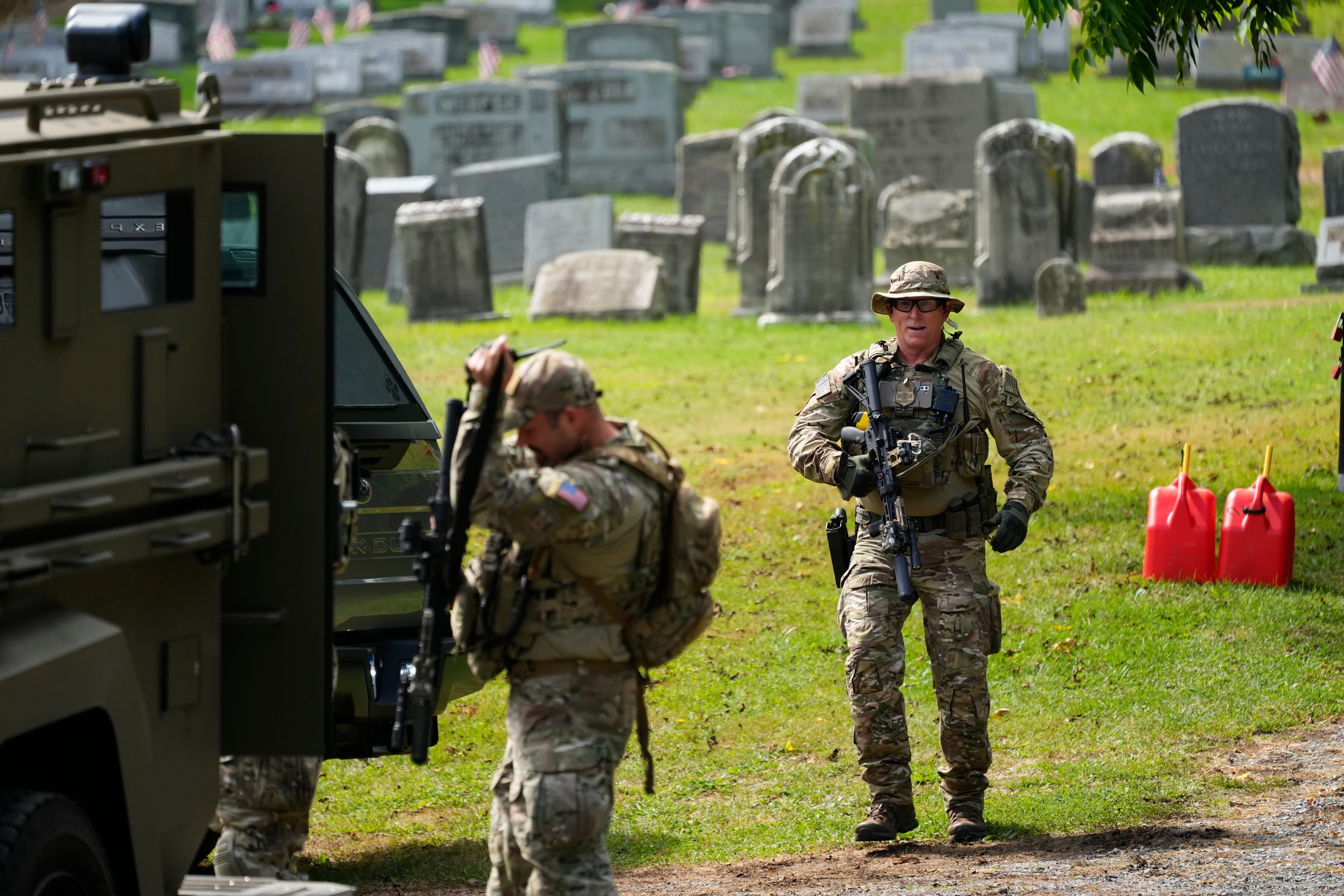 Law enforcement gather as they search for Cavalcante in Glenmoore, Pennsylvania