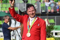 Olympic medallist accused of lying about cancer to delay trial