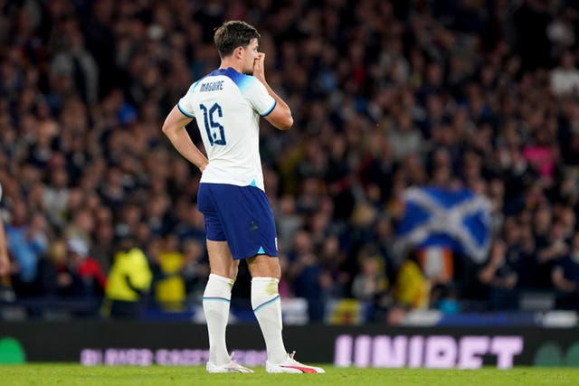 Harry Maguire reacts after scoring an own goal against Scotland (Andrew Milligan/PA)