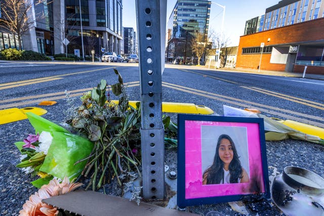 <p>A photo of Jaahnavi Kandula displayed with flowers, Sunday, 29 January 2023 in Seattle, at the intersection where she was killed by a Seattle Police officer driving north while responding to a nearby medical incident</p>