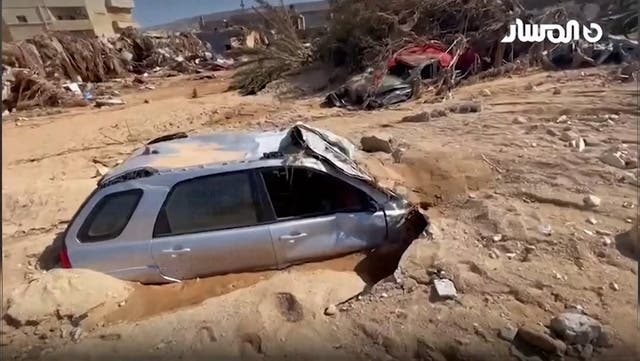 <p>Streets and cars submerged in heavy mud after devastating Libya floods</p>