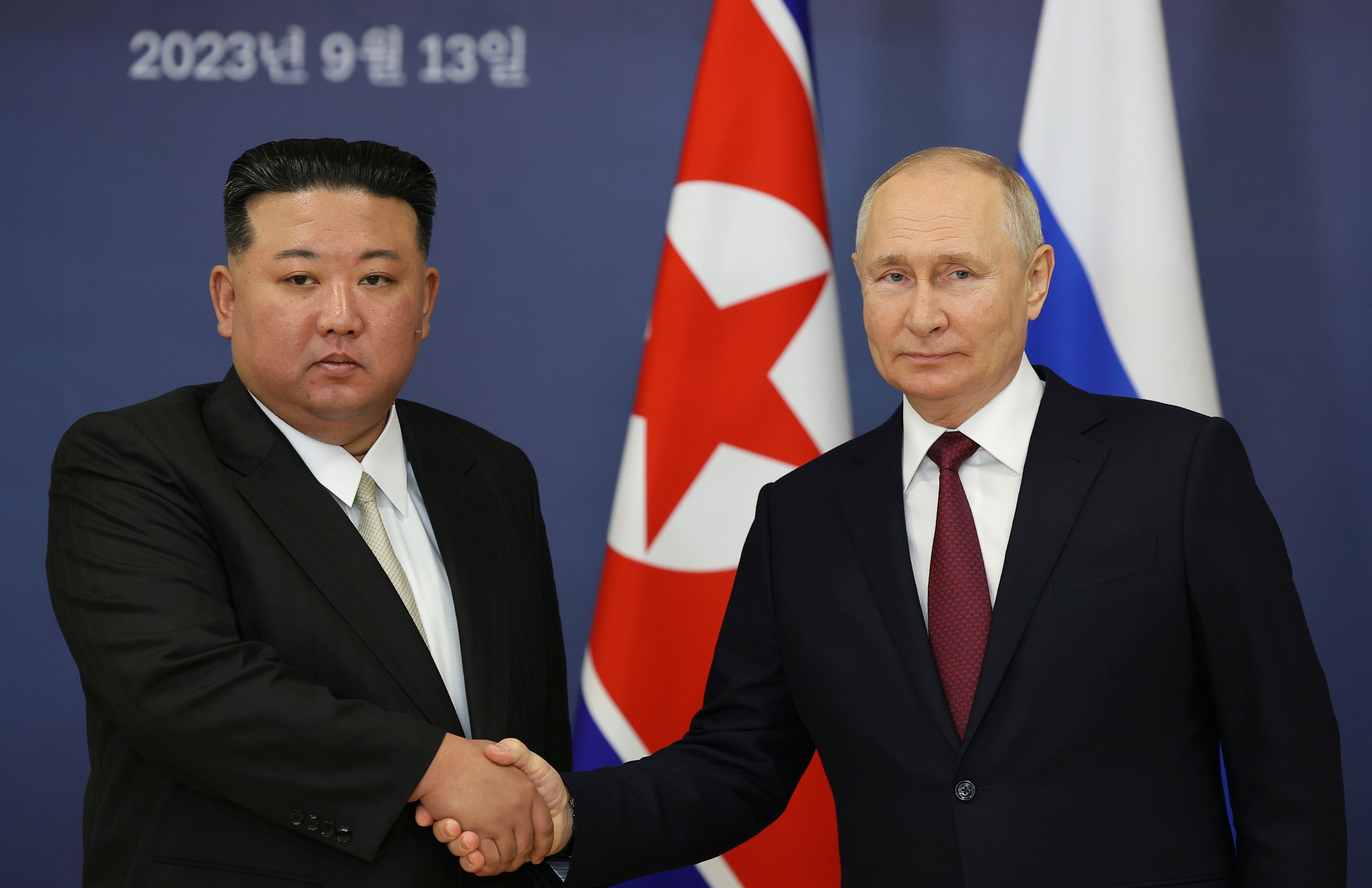Vladimir Putin and Kim Jong-un shake hands during their meeting at the Vostochny Cosmodrome in the far eastern Amur region of Russia, on Wednesday
