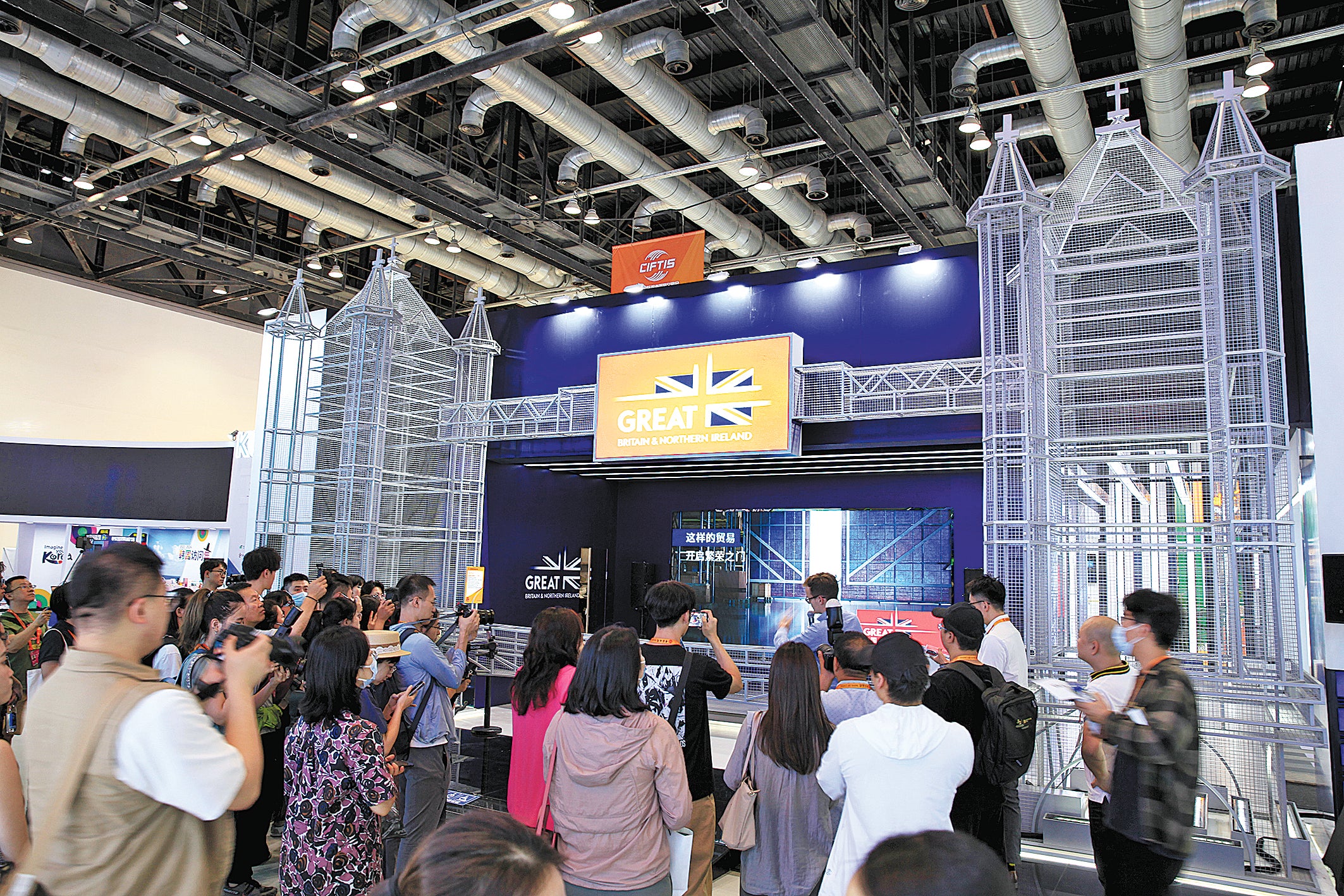 The British exhibition pavilion attracts a throng of journalists prior to the opening of the 2023 CIFTIS