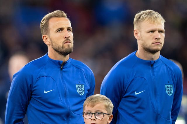 <p>Harry Kane and Aaron Ramsdale line up for the national anthem</p>