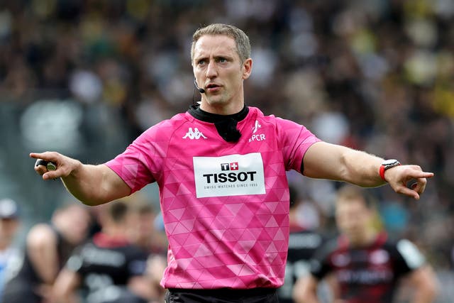 <p>Referee Andrew Brace signals a referral to the TMO </p>