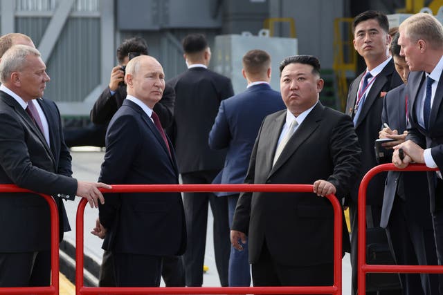 Russian President Vladimir Putin and North Korea’s leader Kim Jong Un examine a launch pad (Mikhail Metzel/PA)