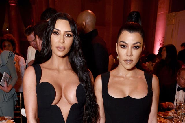 <p>Kim Kardashian (left) with her sister, Kourtney</p>
