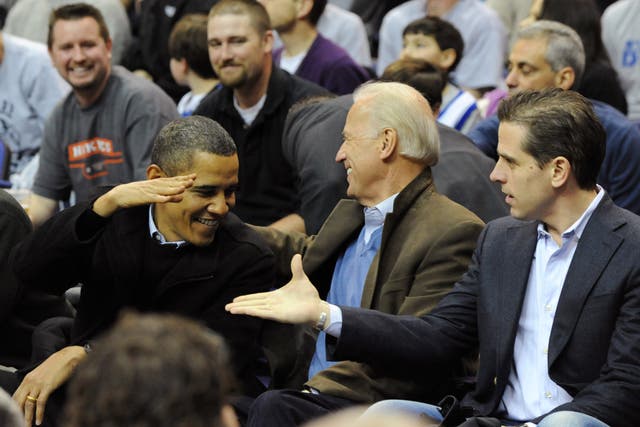 <p>U.S. President Barack Obama (L) greets Vice President Joe Biden (C) and his son Hunter Biden as they attend the game between the Duke Blue Devils and Georgetown Hoyas on January 30, 2010 at the Verizon Center in Washington, DC</p>