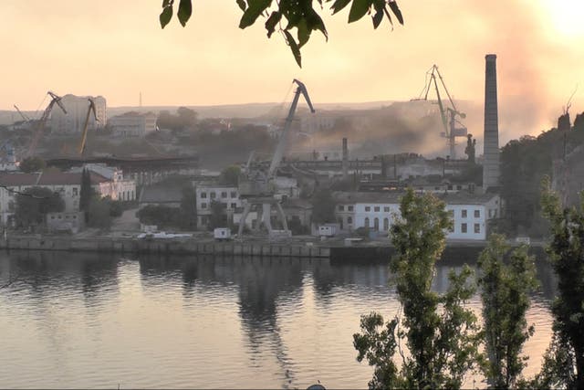 <p>Smoke rises from the shipyard hit by Ukrainian missile attack in Sevastopol last week </p>