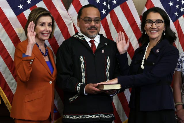 <p>Gene Peltola, centre, participates in the swearing-in of his wife, Congresswoman Mary Peltola, in January.</p>