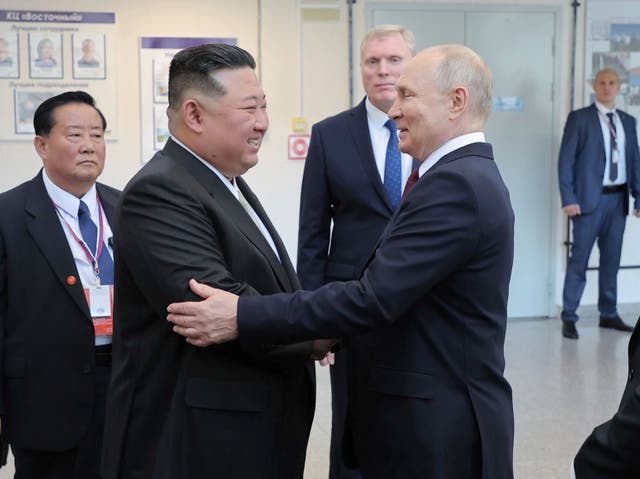<p> Russian President Vladimir Putin, centre right, welcomes North Korean leader Kim Jong-un </p>