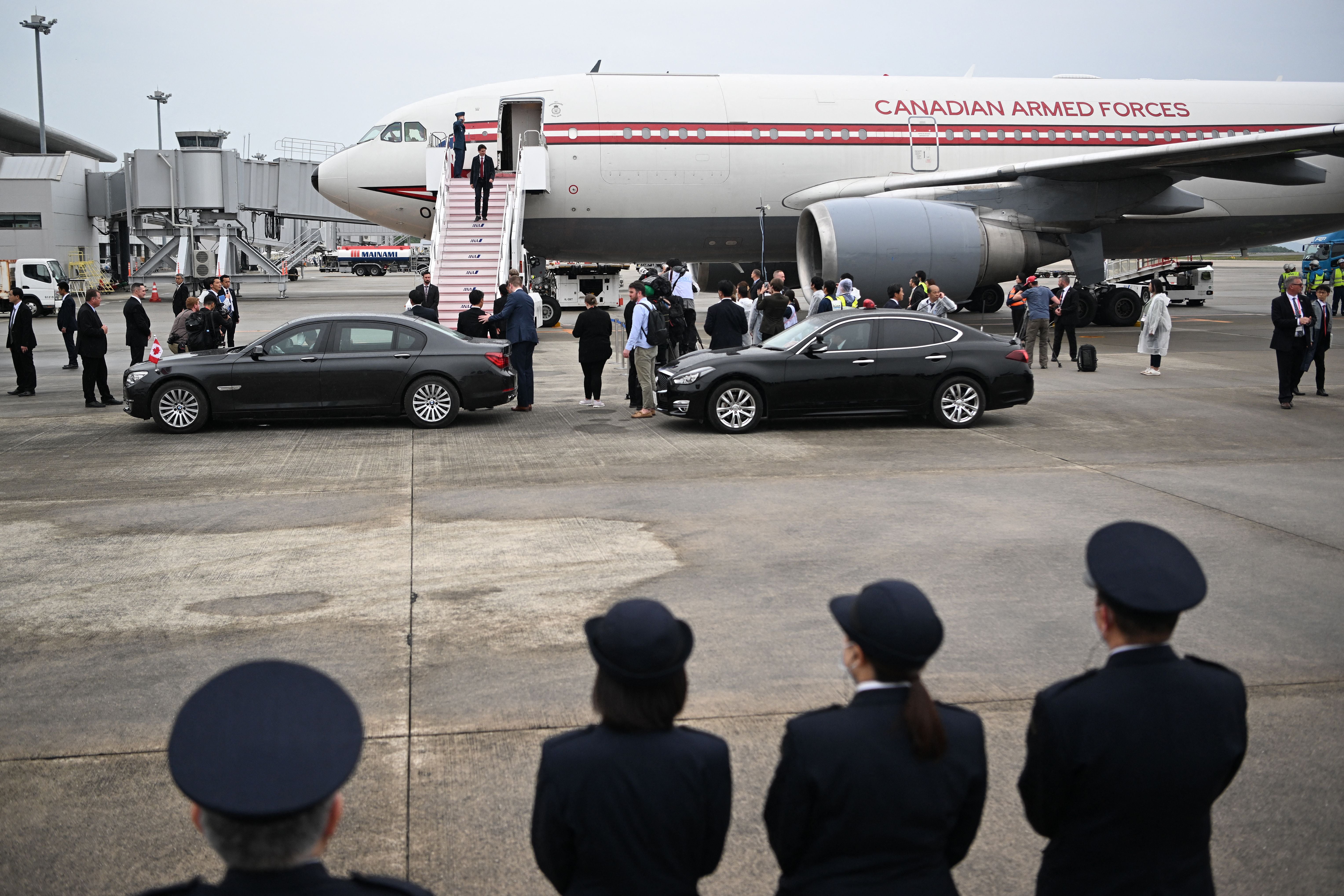 File: Justin Trudeau walks off the plane upon his arrival at Hiroshima airport in Mihara, Hiroshima to attend the G7 Leaders’ Summit