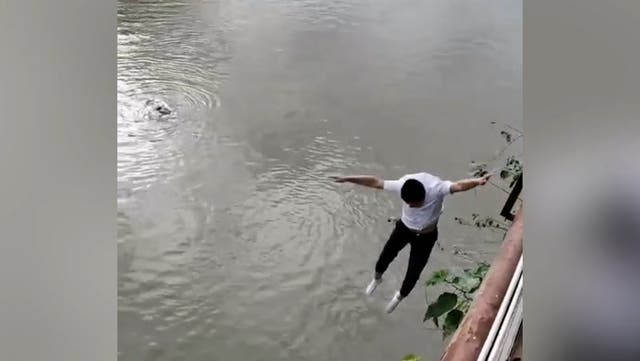 <p>Heroic bystander jumps into fast-flowing river to rescue child being swept away.</p>