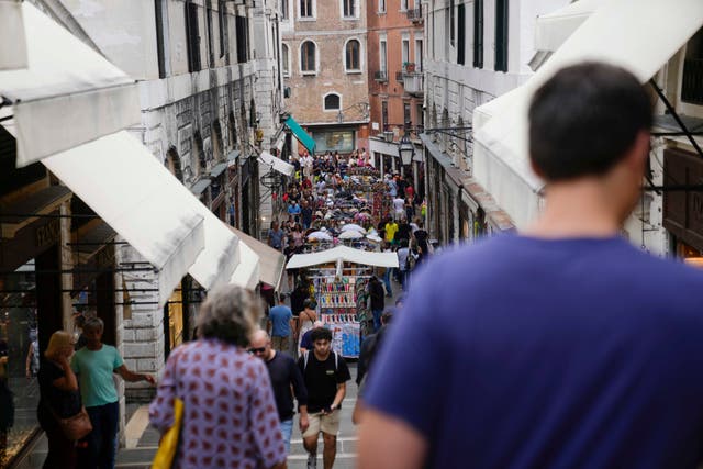 <p>Tourists walk in a crowded street, in Venice, Italy, Wednesday, September 13, 2023</p>