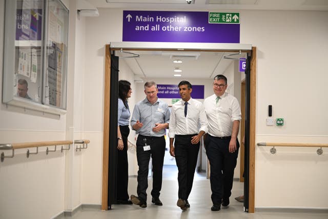 <p>Rishi Sunak on a visit to an NHS hospital  </p>