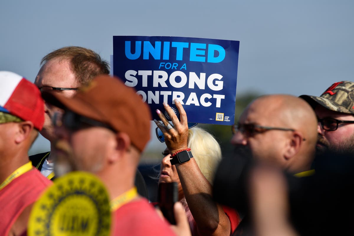 About 13,000 workers go on strike seeking better wages and benefits from Detroit’s three automakers