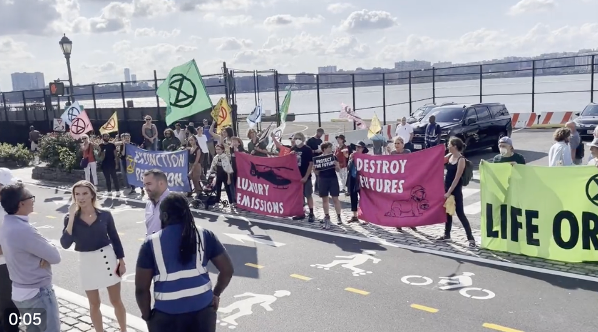 Climate protesters clash with Uber Blade users in New York after blocking heliport entrance