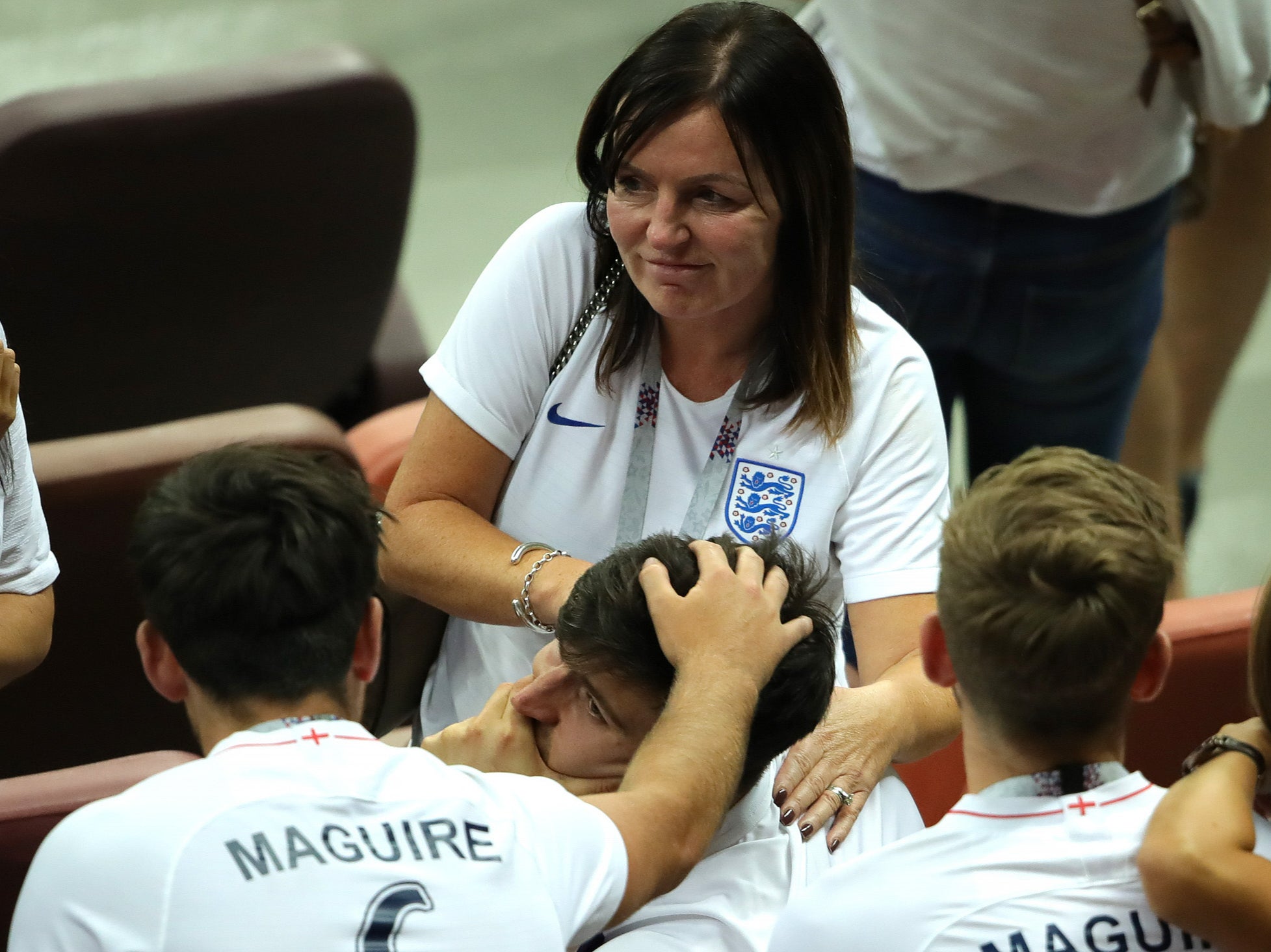 Harry Maguire is consoled by family and friends following England’s 2018 World Cup exit
