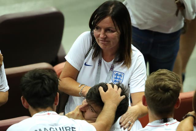 <p>Harry Maguire is consoled by family and friends following England’s 2018  World Cup exit</p>