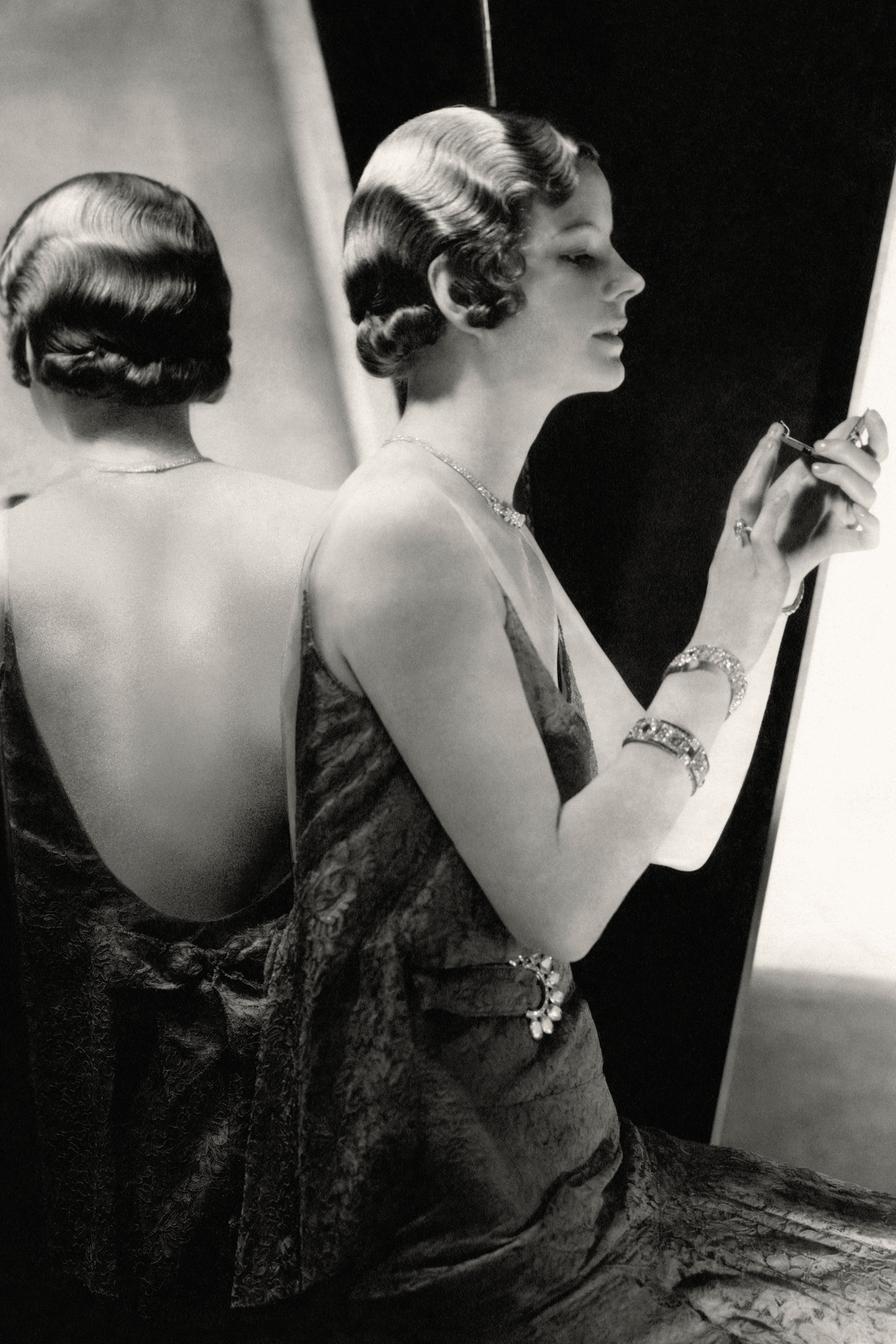 Model Hannah Lee Sherman wears a lace black Chanel dress during a 1930 photoshoot