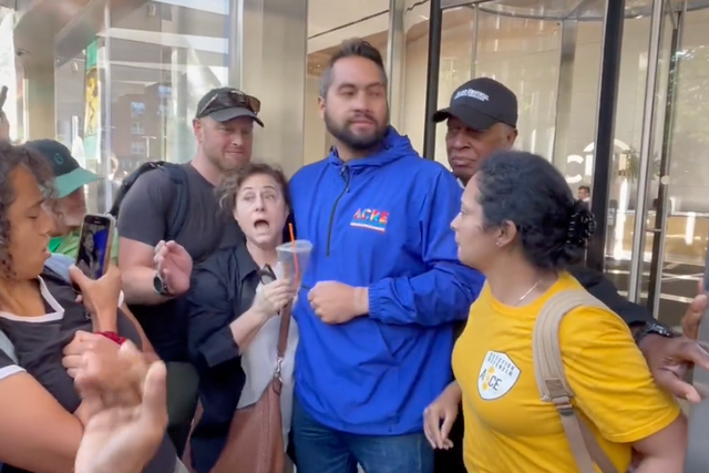 <p>Extinction Rebellion protesters clashed with Citibank employees during a heated exchange outside of the bank’s New York offices on Thursday</p>