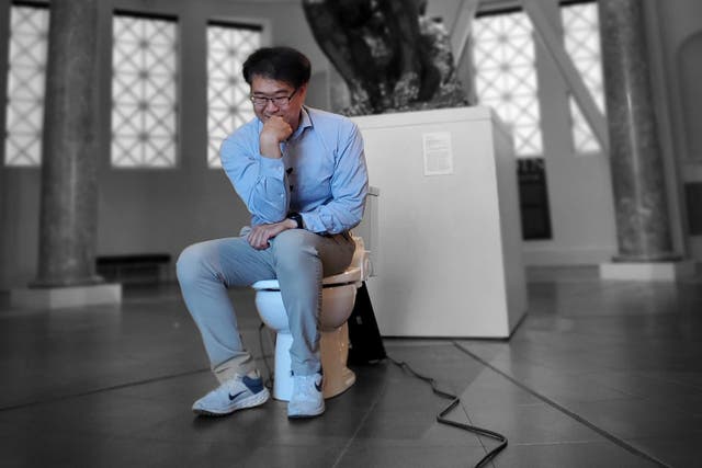 <p>Seung-min Park with the Smart Healthcare toilet at Stanford University</p>