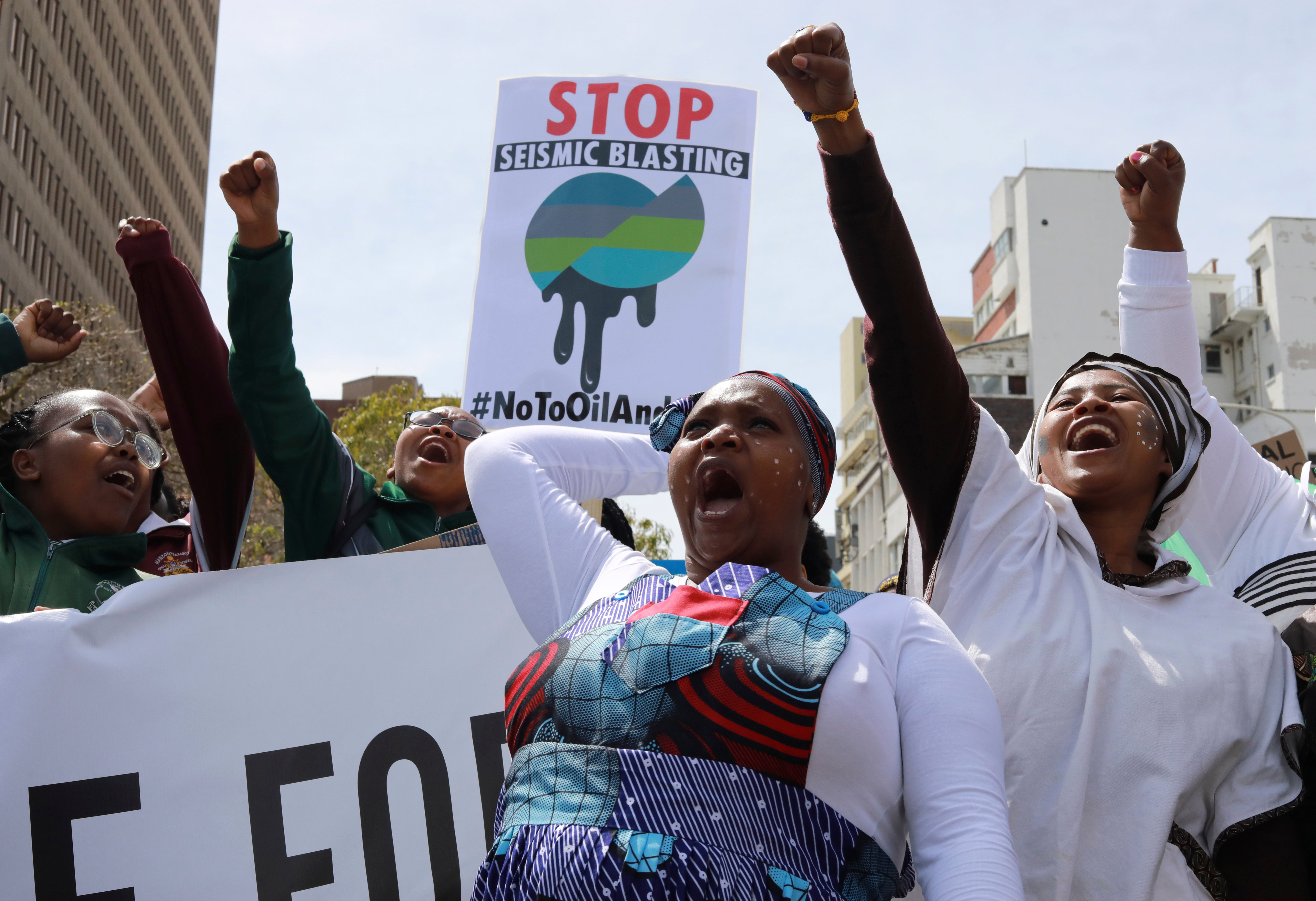 <p>Environmental activists take part in a protest calling for the government to take immediate action against climate crisis in Cape Town. Delegates at Cop28 will be wrangling over compensations to be given to victims of disasters  </p>