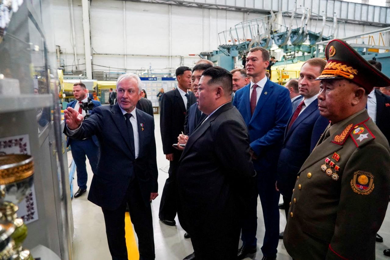 North Korea's leader Kim Jong Un, accompanied by Governor of Russia's Khabarovsk Region Mikhail Degtyarev and other officials