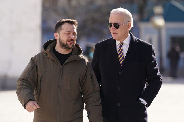 <p>Joe Biden walks next to Ukrainian President Volodymyr Zelensky as he arrives for a visit in Kyiv</p>