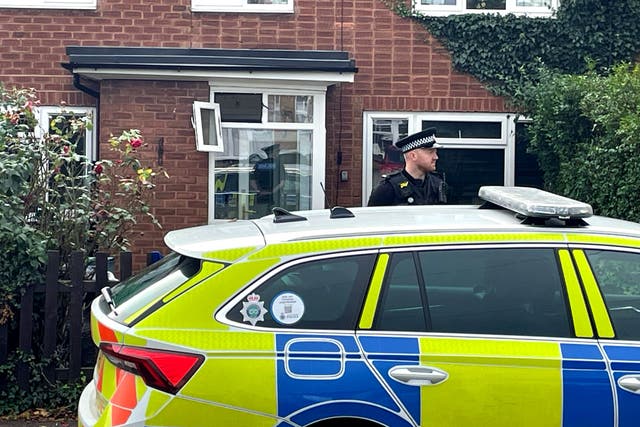 A police officer outside a property in Main Street, Stonnall, Staffordshire, after a man was bitten by two dogs (Matthew Cooper/PA)
