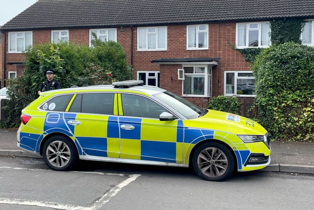 A police officer outside a property in Main Street, Stonnall, Staffordshire (Matthew Cooper/PA)