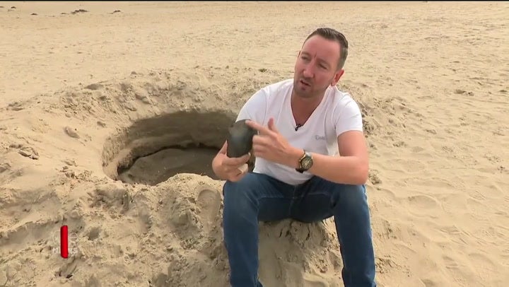 <p>‘Mysterious crater’ found on beach from ‘cosmic event’ turns out to be a hole dug by friends having fun</p>