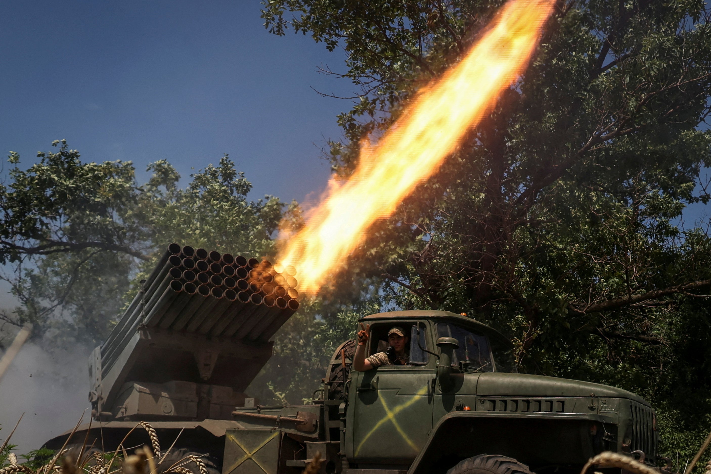 Ukrainian troops fire a rocket launcher near the town of Avdiivka, in the Donetsk region